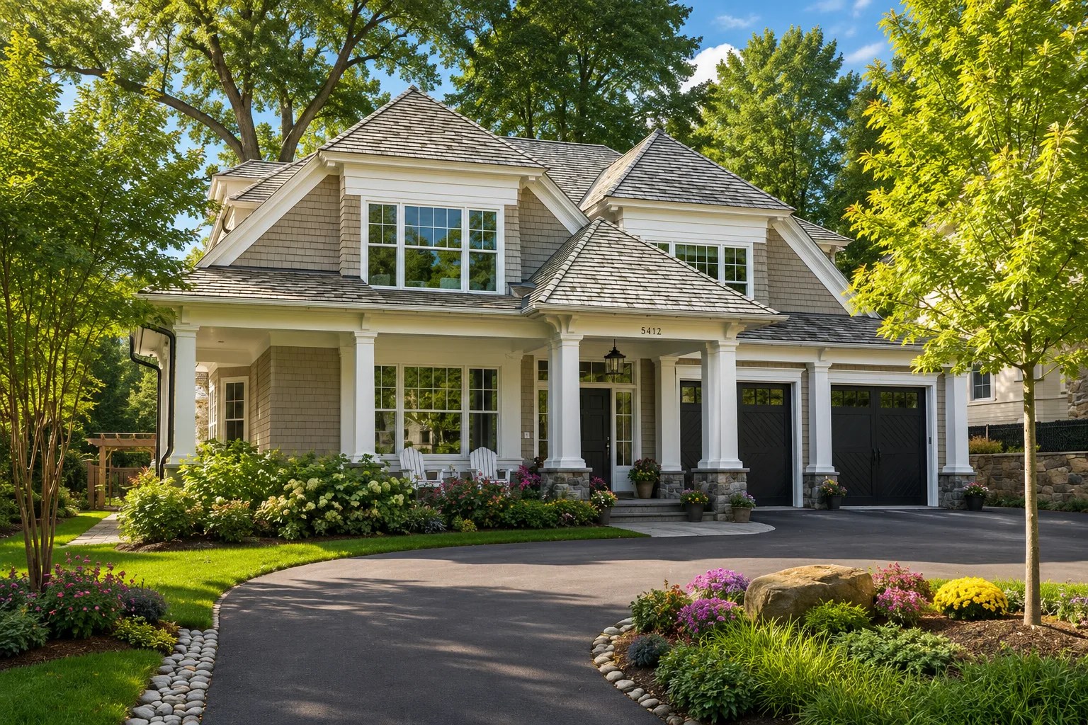 Bright upscale home exterior surrounded by mature trees and landscaping